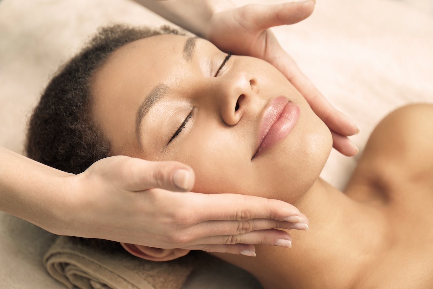 Beautiful African-American girl having massage in spa salon Botox Mississauga